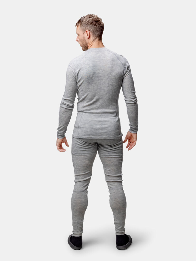 A man wears the Halti Hossa II Mens Merino Base Layer Set, facing away against a plain white background.