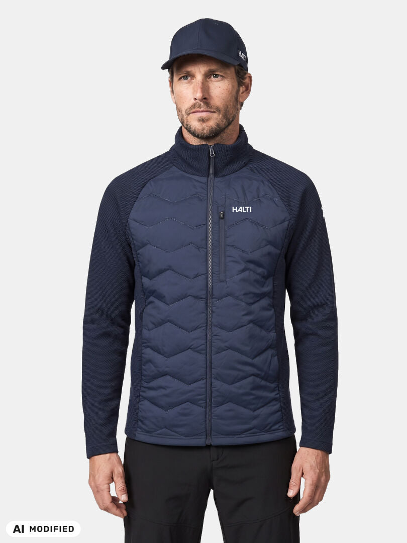Man in Halti Suomis Hybrid Layer Jacket and matching cap, standing against a plain white background.