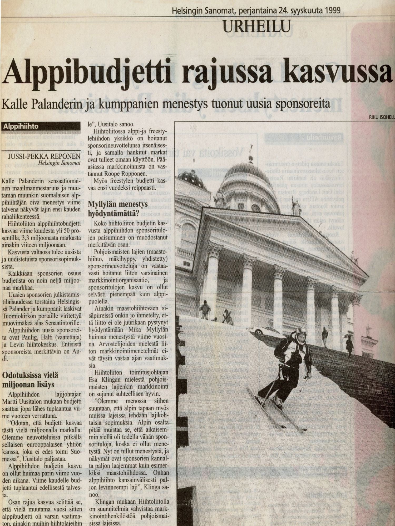 Newspaper article with a photograph of a building and two people skiing.