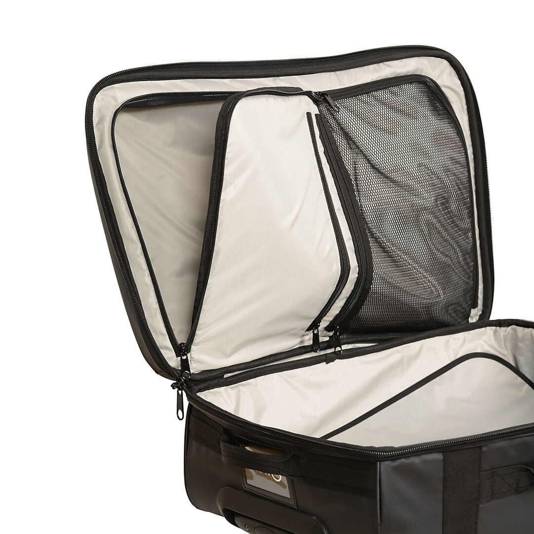 The Halti Attitude Wheels Bag features a white interior, black trim, mesh pockets, and a sturdy telescopic handle.