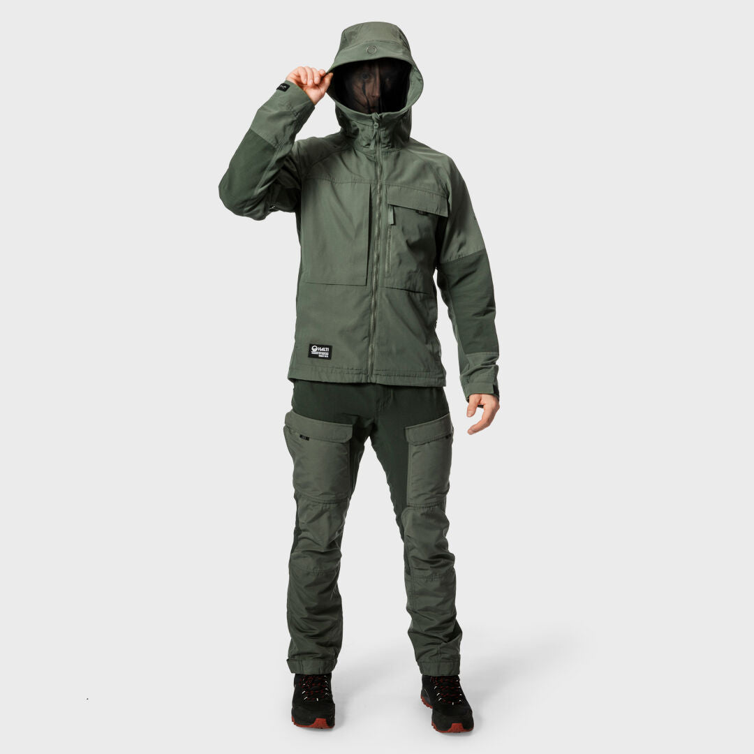 Person wears Halti Hiker Mens Ventilated Pants and an olive green hooded jacket, holding the hood.