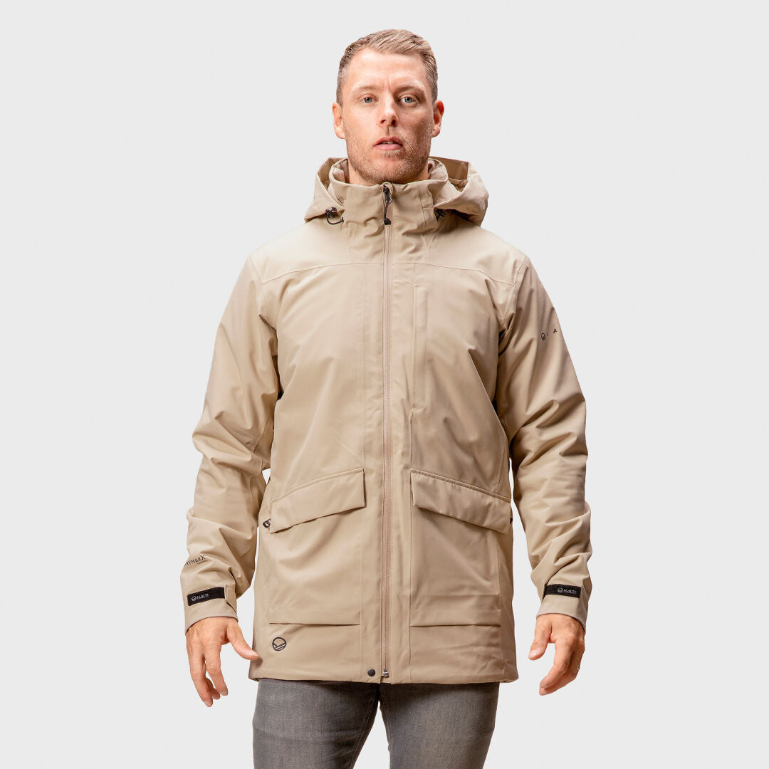 A man faces forward wearing the Halti Olhava DrymaxX Parka with breathable wadding, against a plain light background.