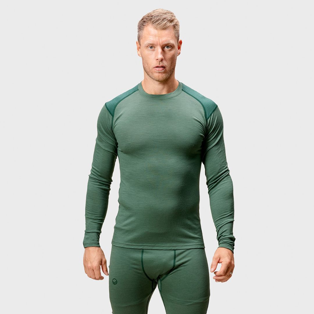 A man wears the Halti Pihka II Merino Baselayer Shirt Mens, facing forward against a plain background.