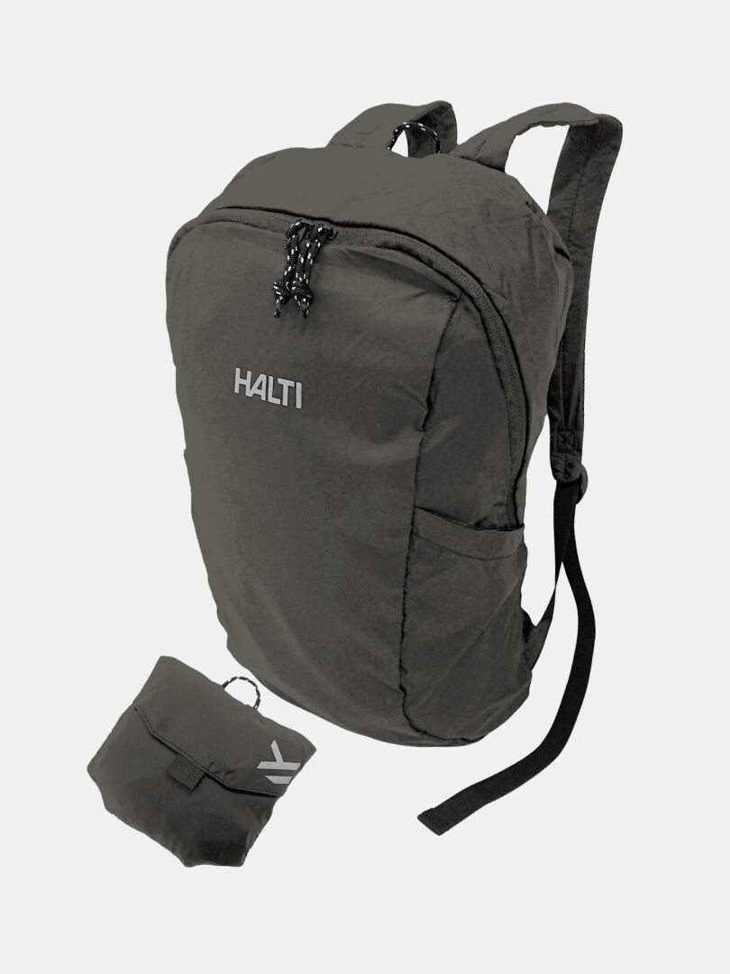 The Halti Streetpack Backpack in dark gray, packable with shoulder straps, shown beside its recycled nylon pouch.