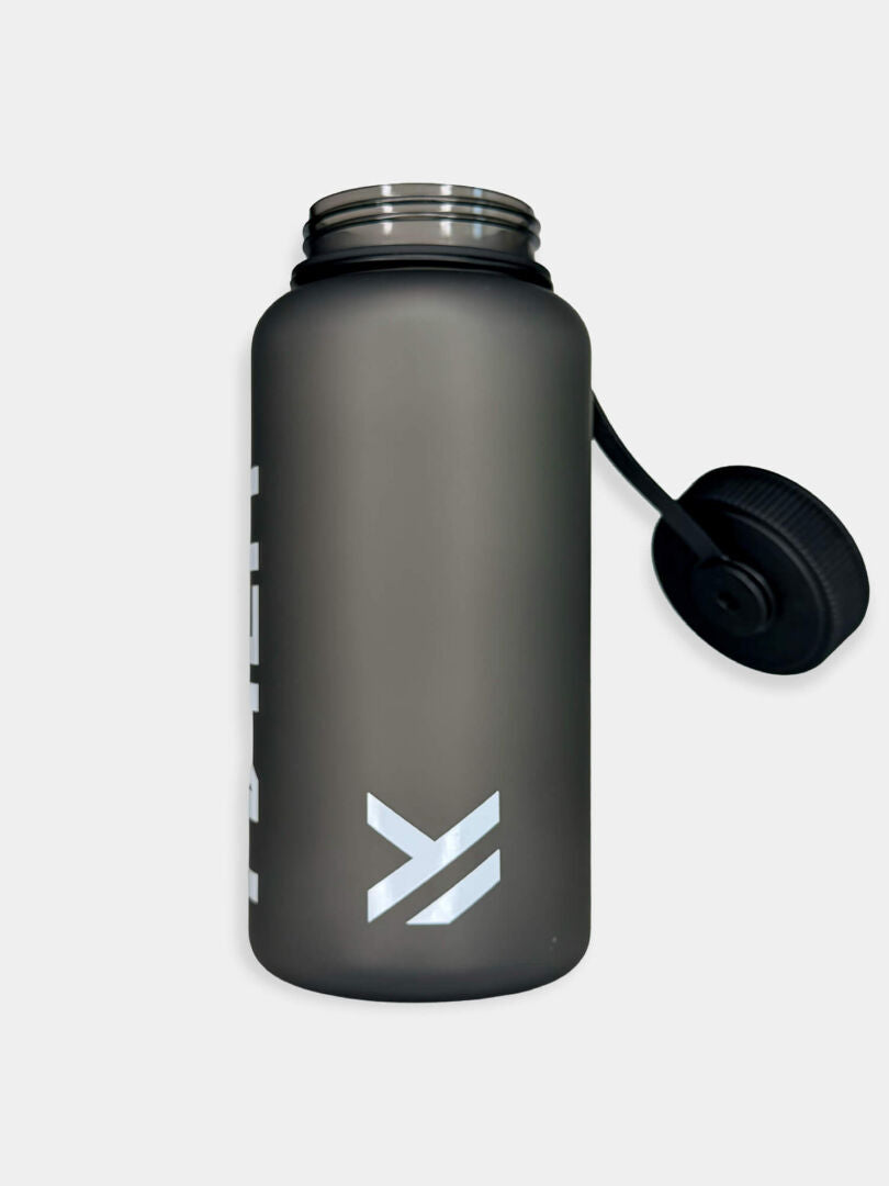 The Halti Drinking Bottle 1000 ML is a matte gray, leakproof bottle with wide mouth, black lid, strap, and white logo.
