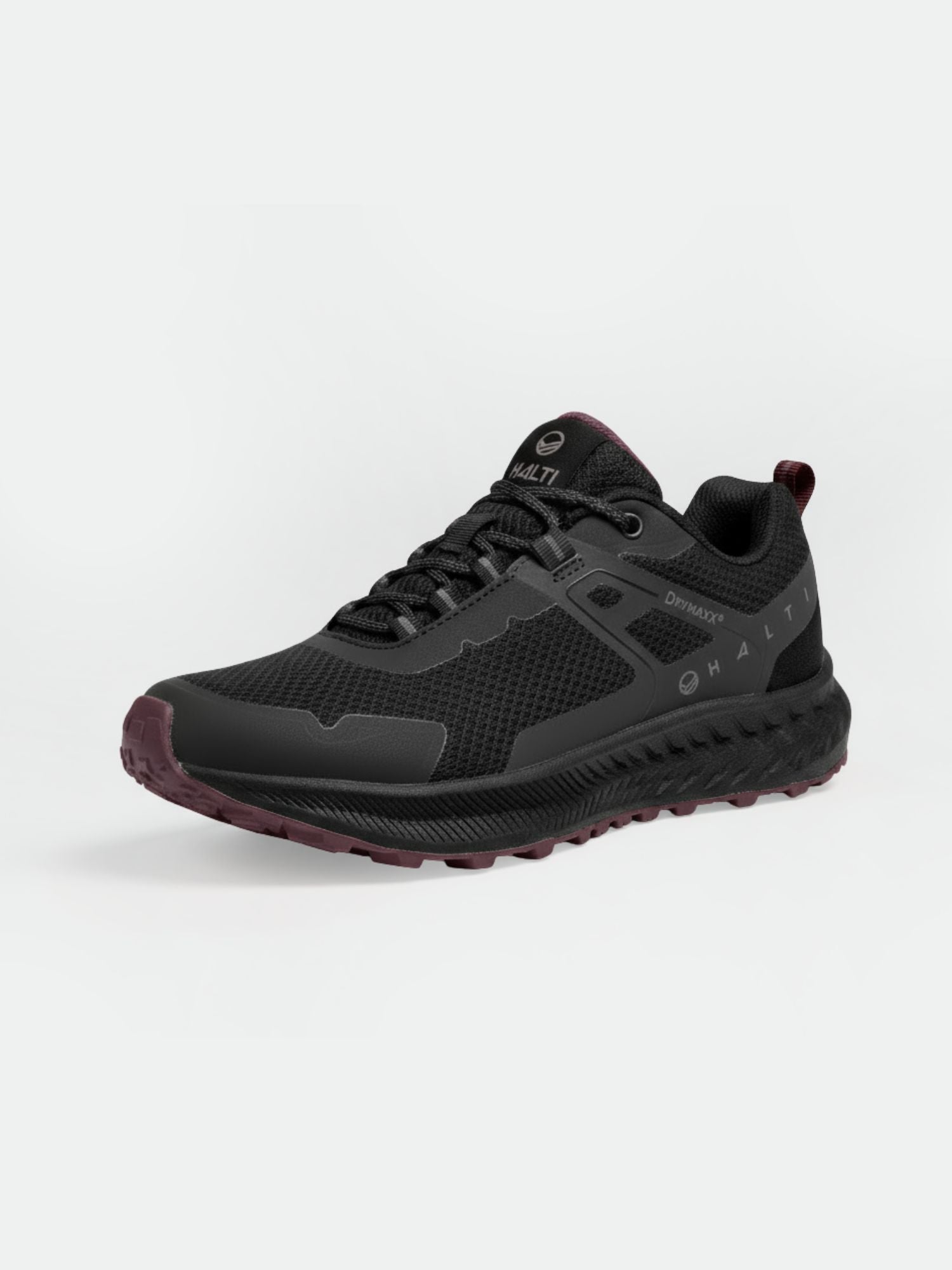 Halti Pallas Low 2 DrymaxX Hybrid Sneaker for men in black with recycled mesh upper and maroon-tinted sole on white background.