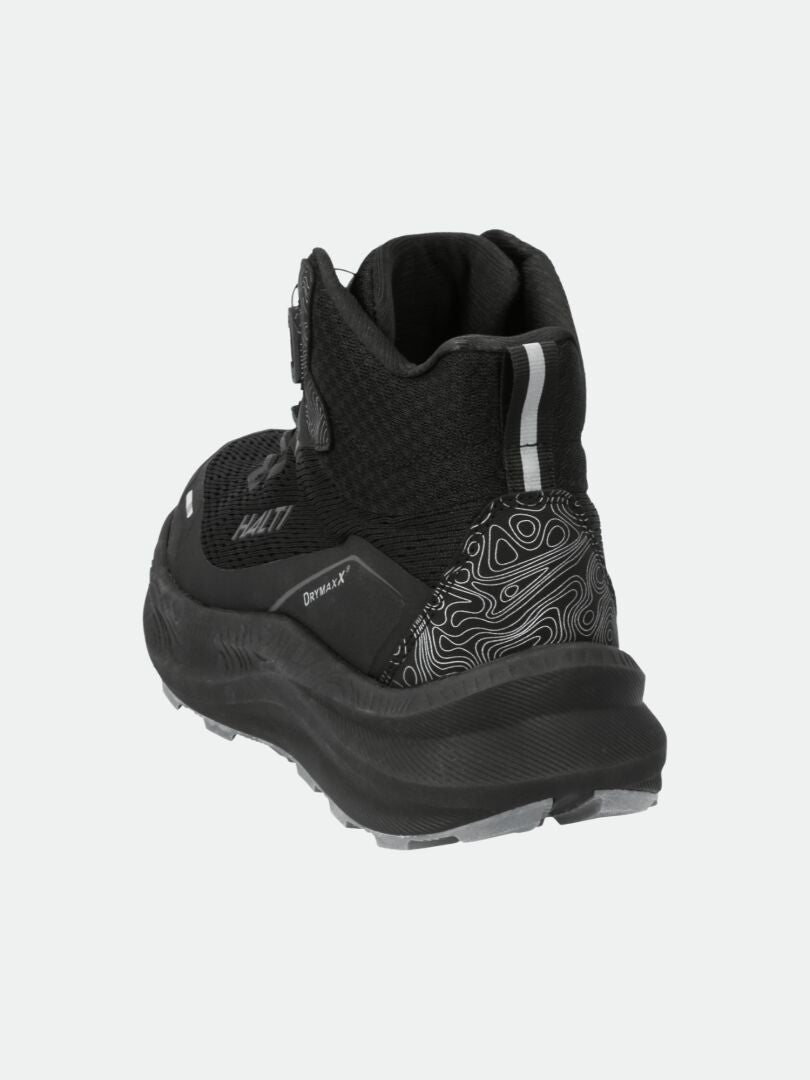 The Halti Rapid Mid Freelock DX Shoe Unisex in black has a textured sole and patterned heel, shown from the back.