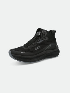 Halti Rapid Mid Freelock DX unisex black high-top sneaker with mesh upper and thick sole, on a plain background.
