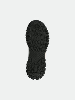 The image shows the black, textured sole of the Halti Korpi DX Mens Outdoor Shoe, viewed from the bottom.