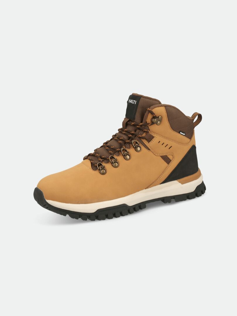 The Halti Korpi DX Mens Outdoor Shoe features a tan and brown design with black accents and a rugged sole.