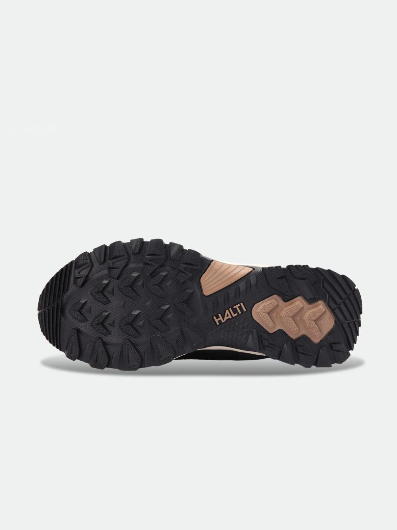 Black Tornio 2 DX Winterboot showing a GripmaxX Arctic outsole with a tan arch support section.