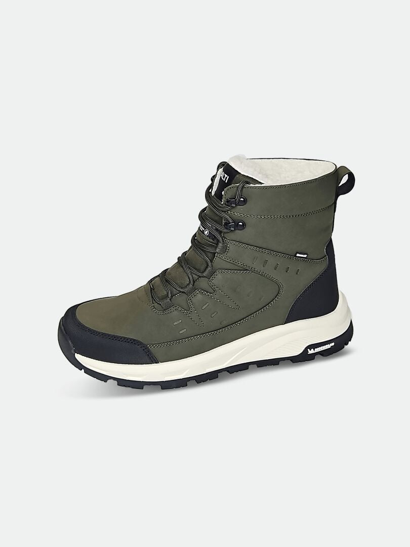 The Halti Fjalla 2 DX Ice Control Men’s winter boot features green and black uppers, a thick white sole, and rugged tread.