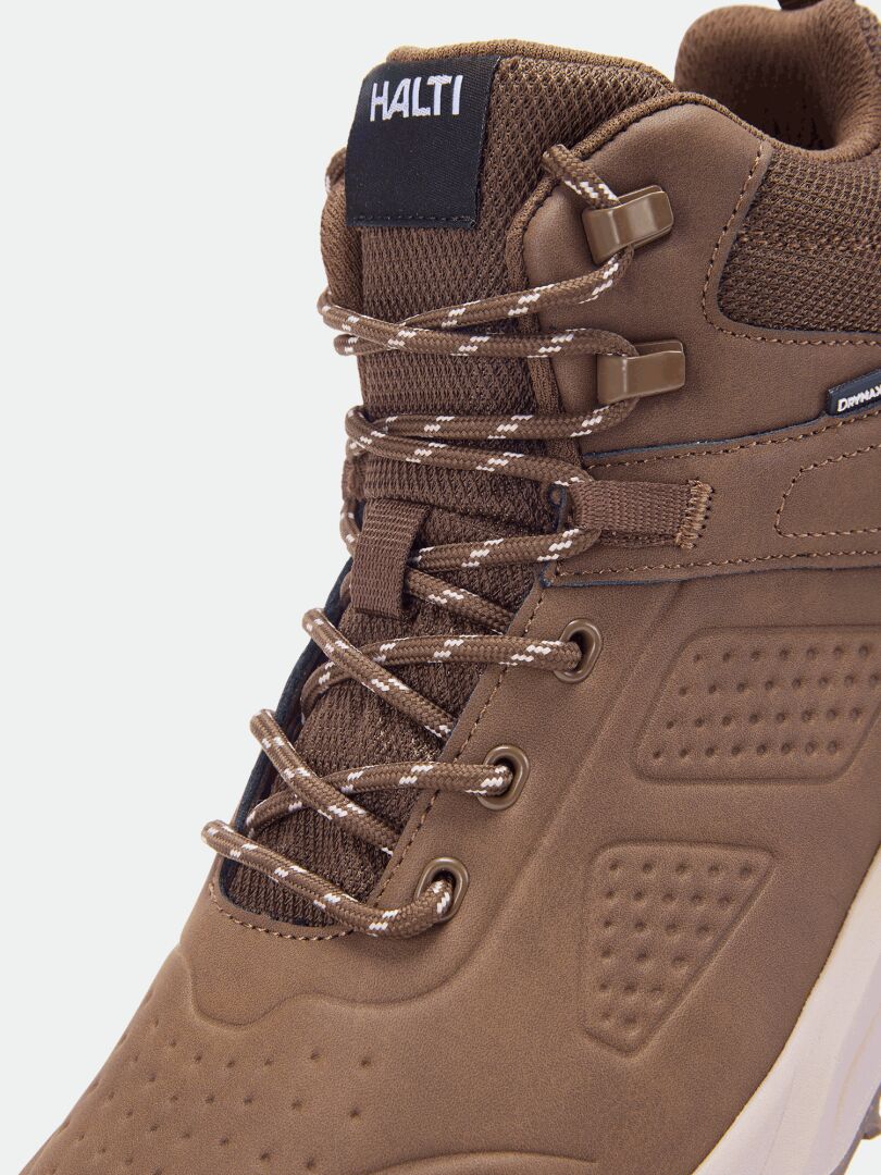 Close-up of Halti Morgam Mid DX men’s brown walking shoe with patterned laces, ankle support, and branded tongue.