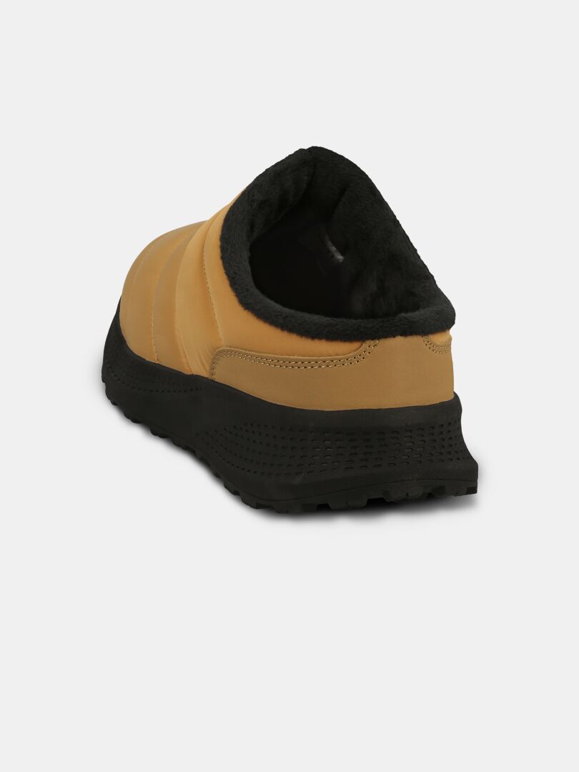 Halti Rest 2 Slipper: tan slip-on with black fuzzy lining, memory foam insole, and textured sole, back view.