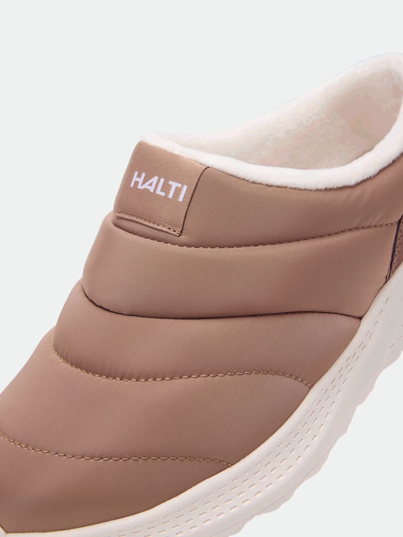 Close-up of Halti Rest 2 tan slip-on slipper with memory foam insole, white sole, and soft lining.