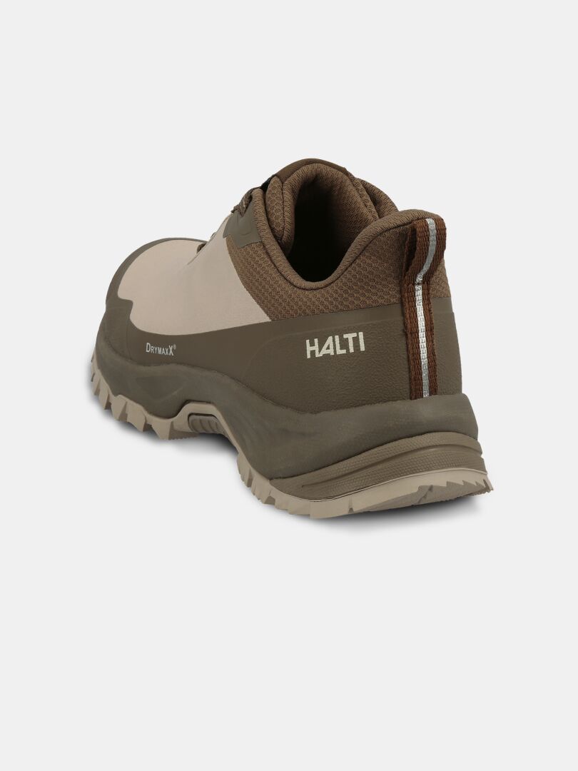 The Halti Fara Low 3 DX Women’s outdoor shoe, in brown/beige, has a pull tab and GripmaxX Trail outsole.