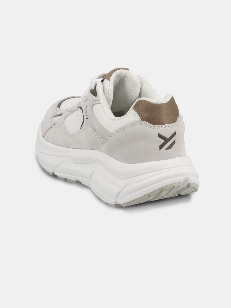 Halti Tove Sneaker Women's: light gray casual shoe with thick white sole, brown heel accent, and black arrow logo.