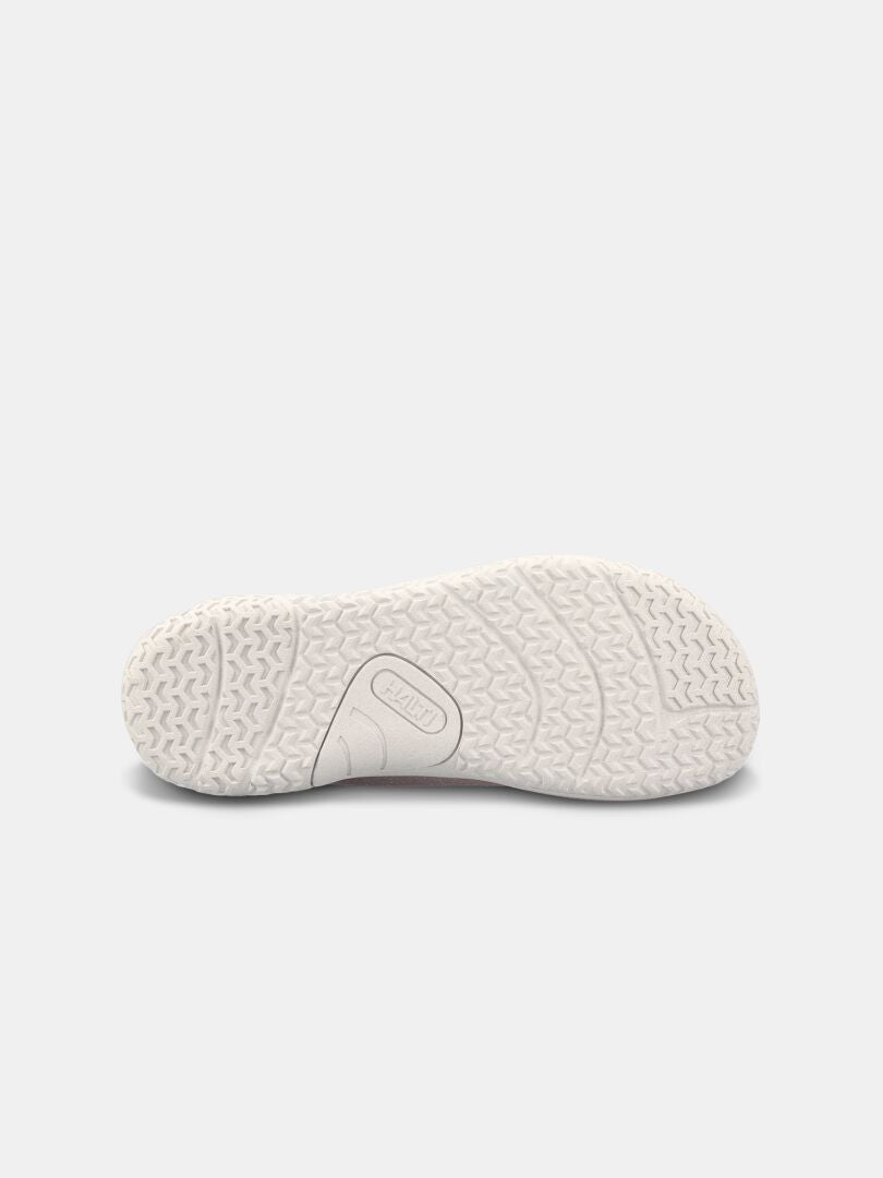 Bottom view of Halti Vire Barefoot Shoe Women's white sole with wavy tread on a light gray background.