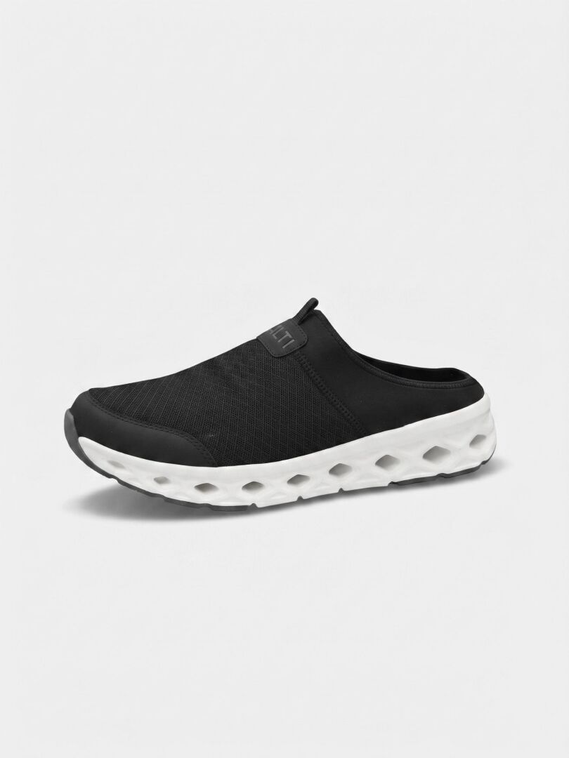 The Halti Lago 3 Sandal is a black slip-on with a white ventilated sole and breathable mesh upper.
