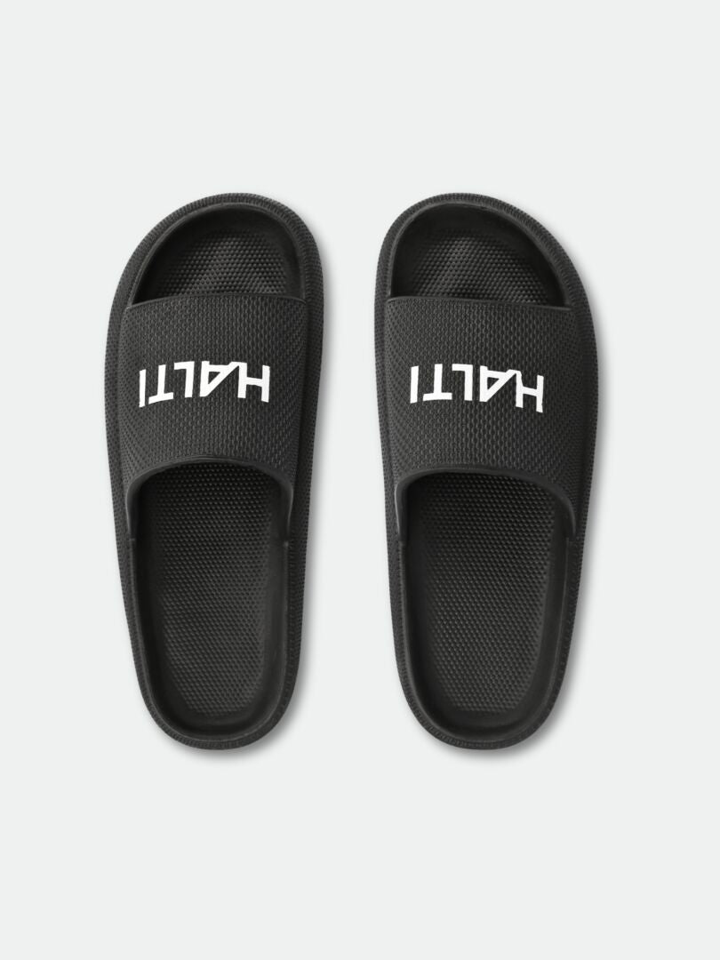 A pair of black Halti Eazy 2 Sandals with bold white HALTI lettering on each band.
