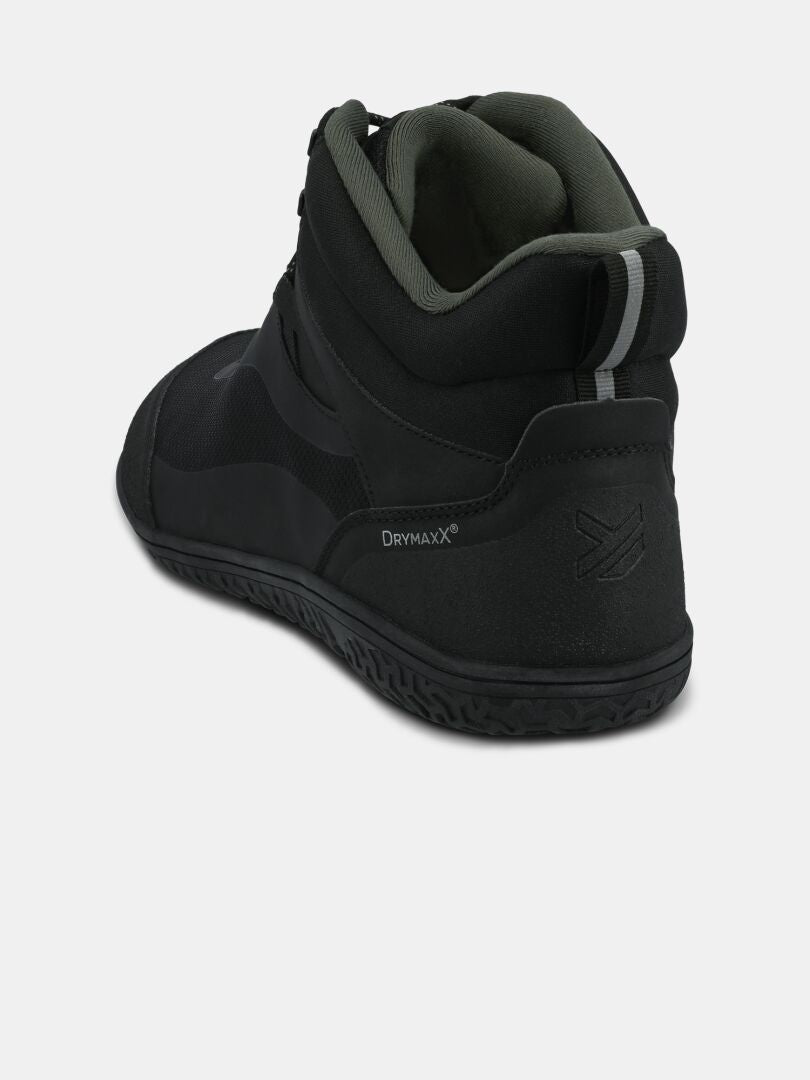 Rear view of Halti Tuntuma Mid DX men’s barefoot shoe in black with gray lining, Drymaxx® logo, and textured sole.