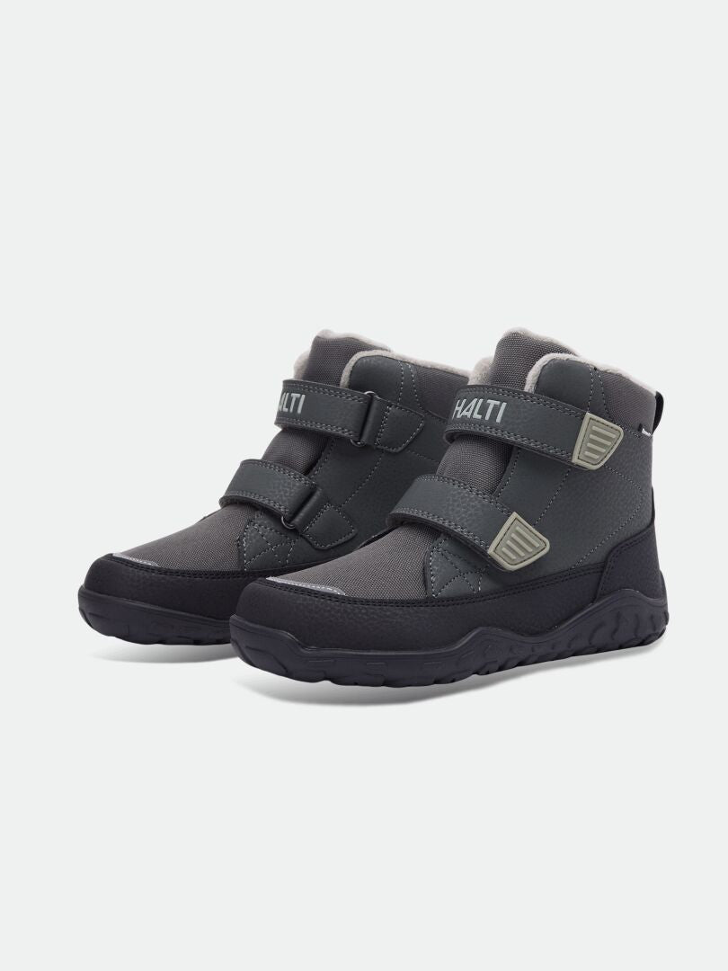 Halti Jalava DX kids’ waterproof barefoot ankle boots—dark grey with Velcro, ideal for outdoor play and natural movement.