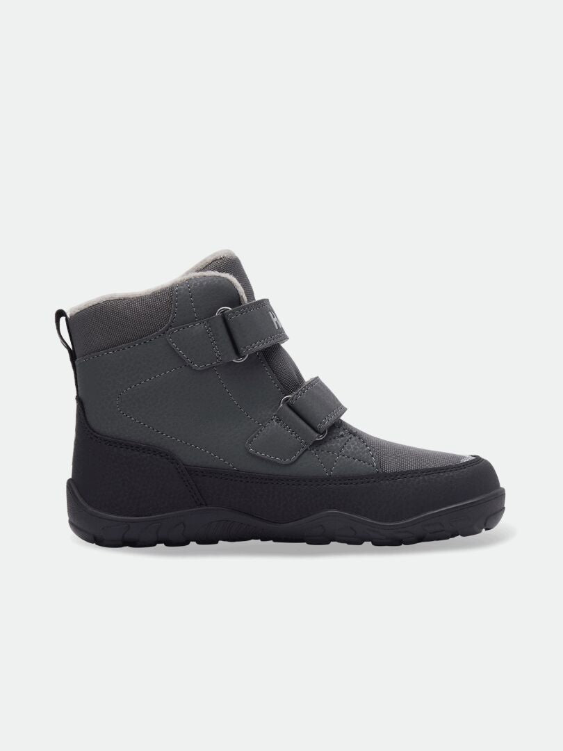 Halti Jalava DX is a dark gray kids’ barefoot ankle boot with two straps, waterproof for natural outdoor play.