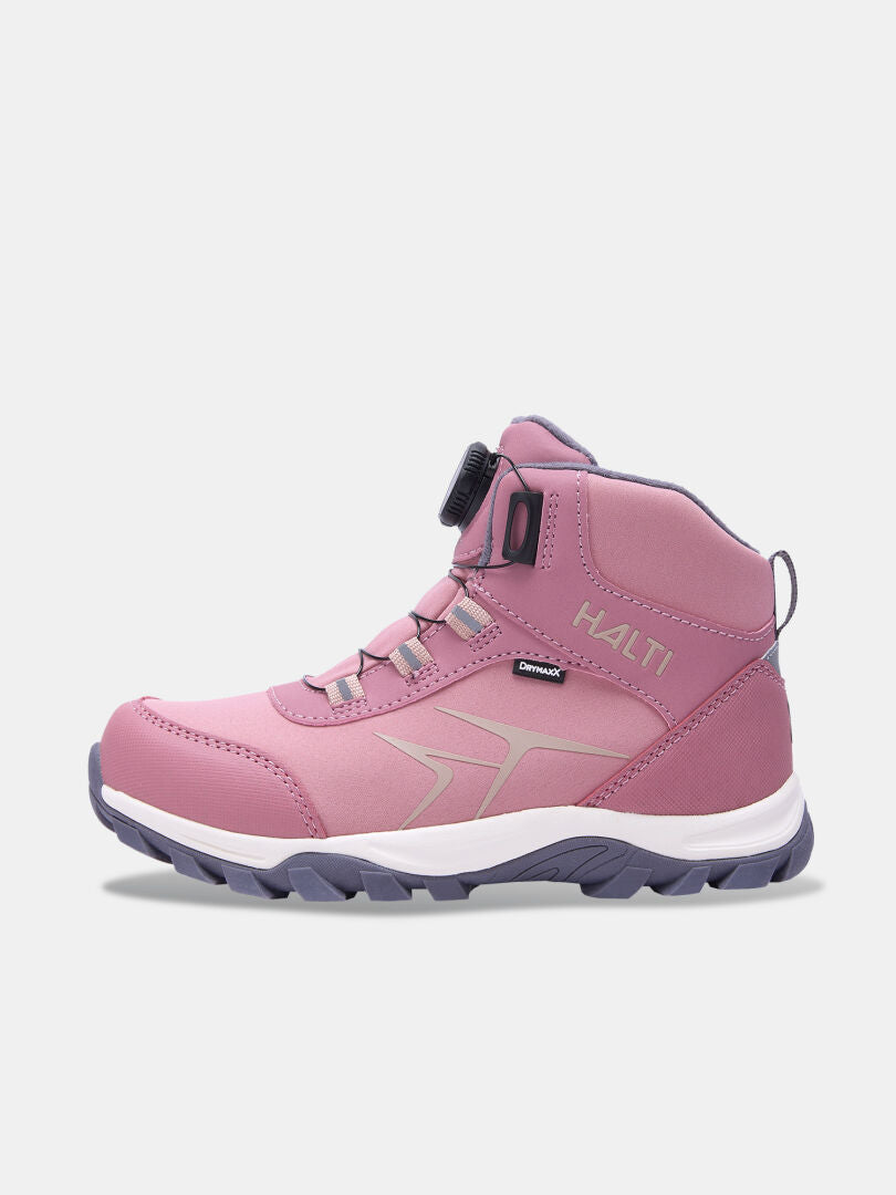 Lightweight pink Tribe Dada DX Outdoor Shoe children’s mid-top with a dial lacing system and a grey lugged sole.