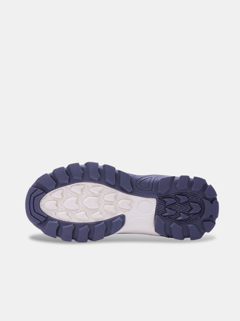 Bottom view of a Tribe Dada DX Outdoor Shoe children’s waterproof shoe with a thick-lugged blue and cream rubber sole.