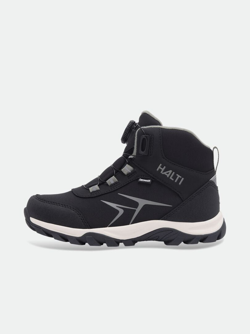 Black Halti Tribe Dada DX Outdoor Shoe for kids with a dial lacing system and a thick, light-colored lug sole.