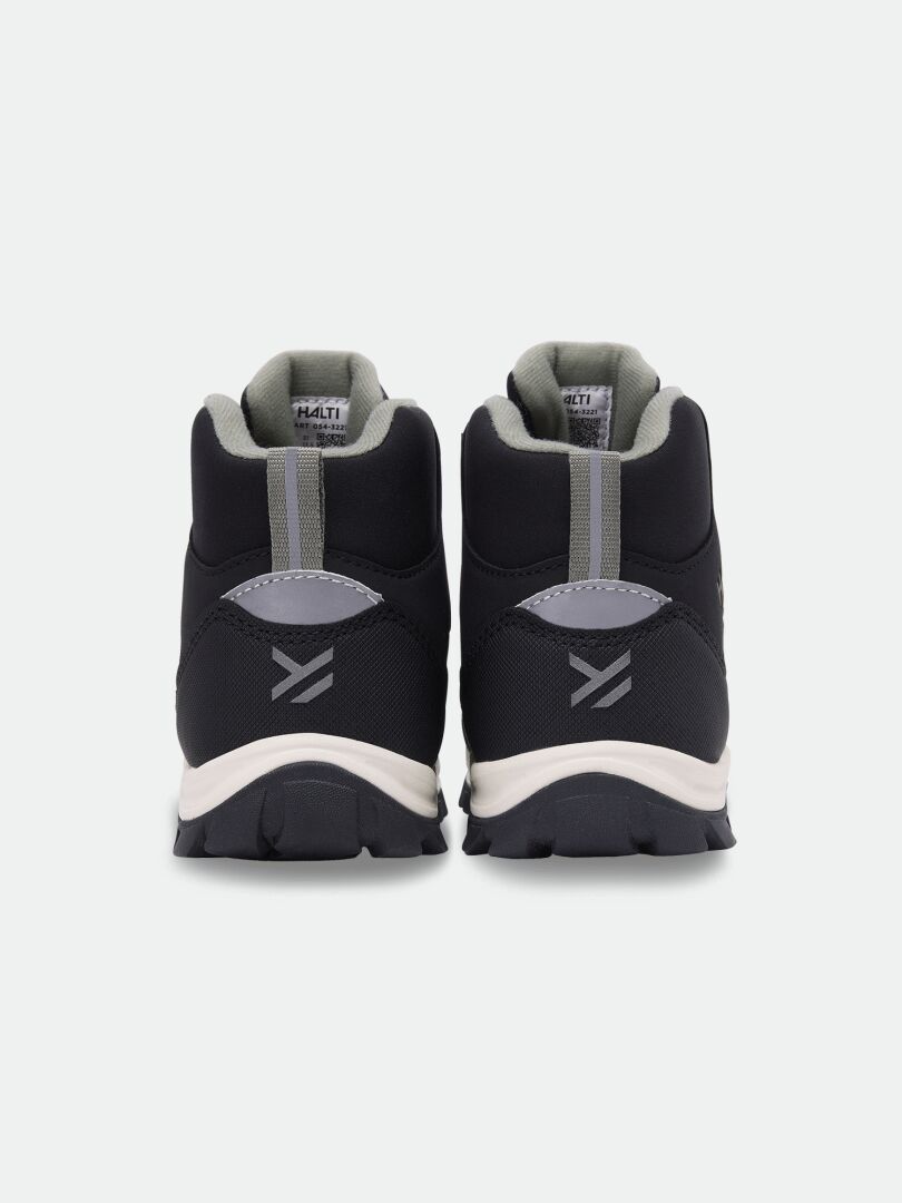 Back view of black, lightweight Halti Tribe Dada DX Outdoor Shoe children’s mid-cut shoes with light soles.