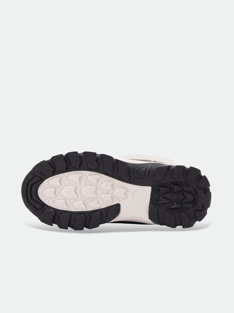 Bottom view of Halti Tornio DX Winter Boot Children’s shows a rugged black-white sole with thick tread for traction.
