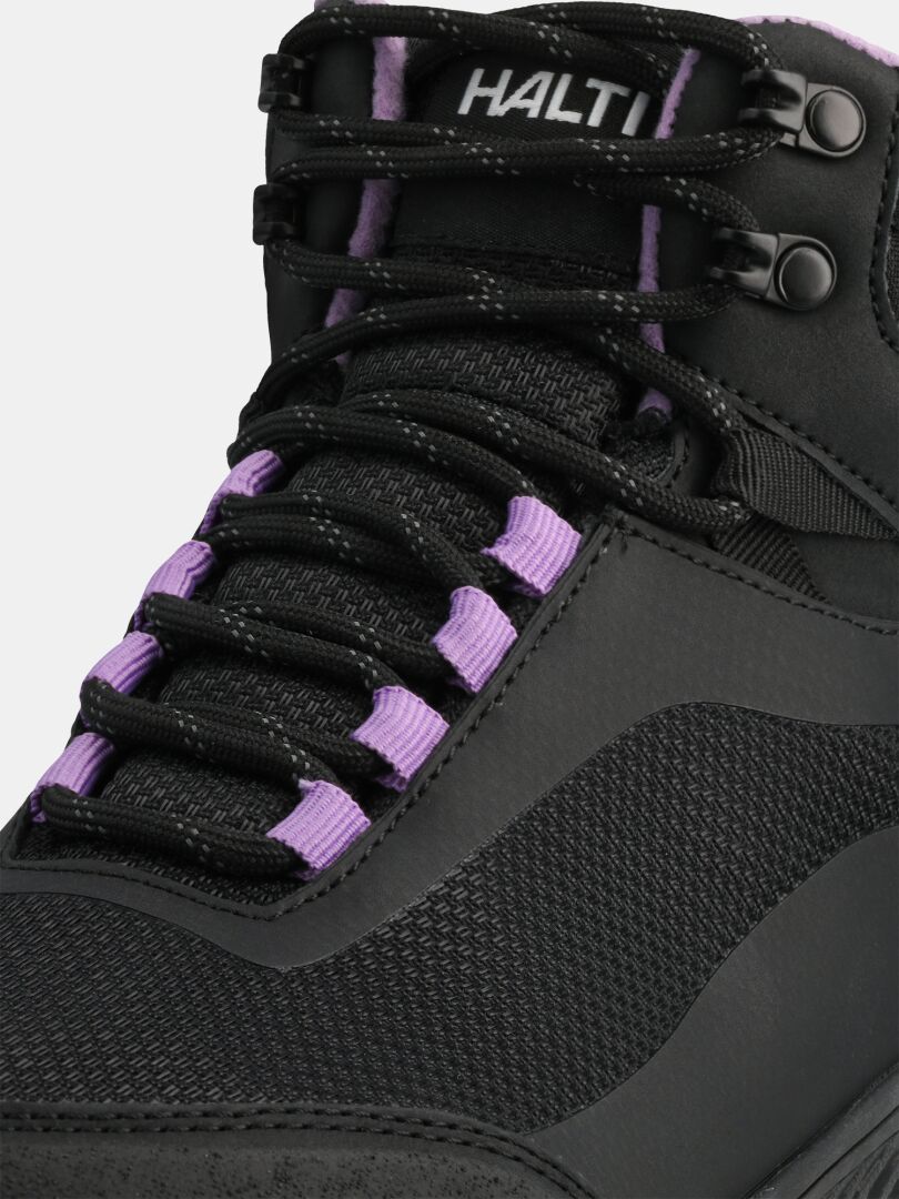 Close-up of Halti Tuntuma Mid DX barefoot shoe for women, black with purple lace loops and branded tongue.