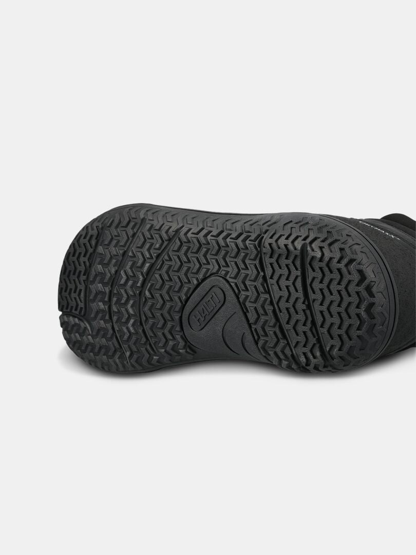 Close-up of the Tuntuma Mid DX Women’s textured black sole, highlighting Halti branding and tread pattern.