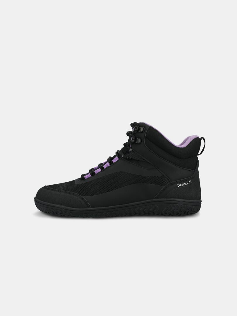 Halti Tuntuma Mid DX Women’s black midcut barefoot shoe with purple accents and textured sole, shown side profile.