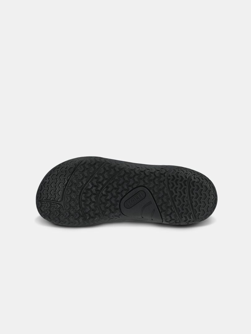 Halti Tuntuma Mid DX Women’s: black textured-grip sole for waterproof barefoot shoes, shown on a light background.