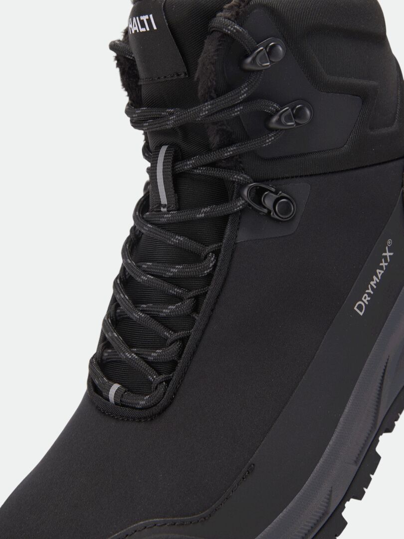 Black Tunturi Mid DX IC Winter Shoe with a fleece-lined collar and a Michelin Ice Control outsole.