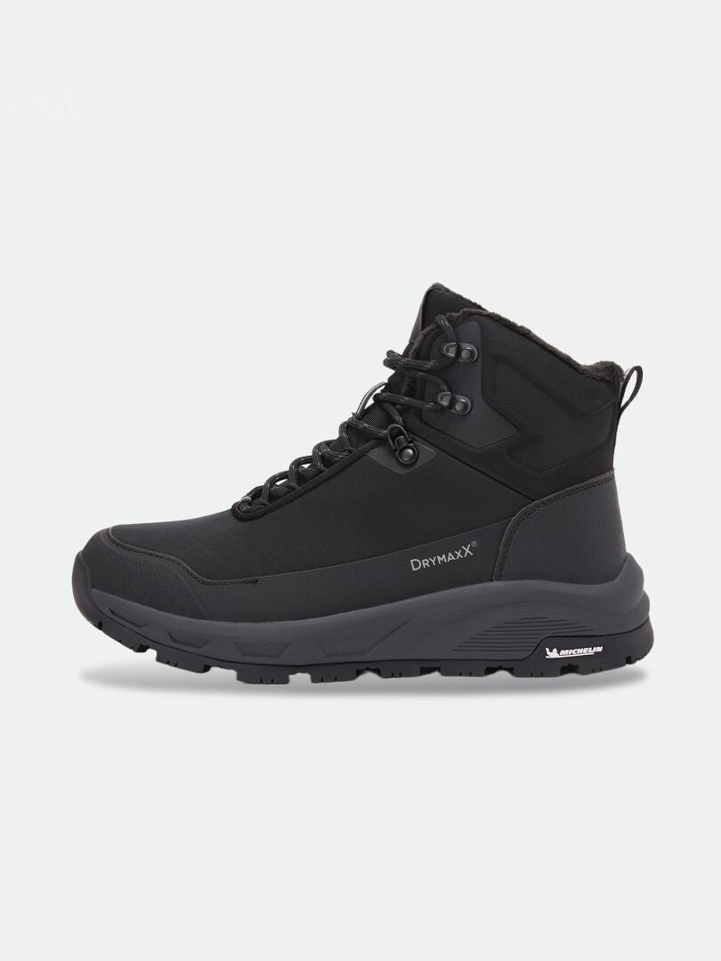 Black Tunturi Mid DX IC Winter Shoe with laces and a thick Michelin Ice Control outsole.