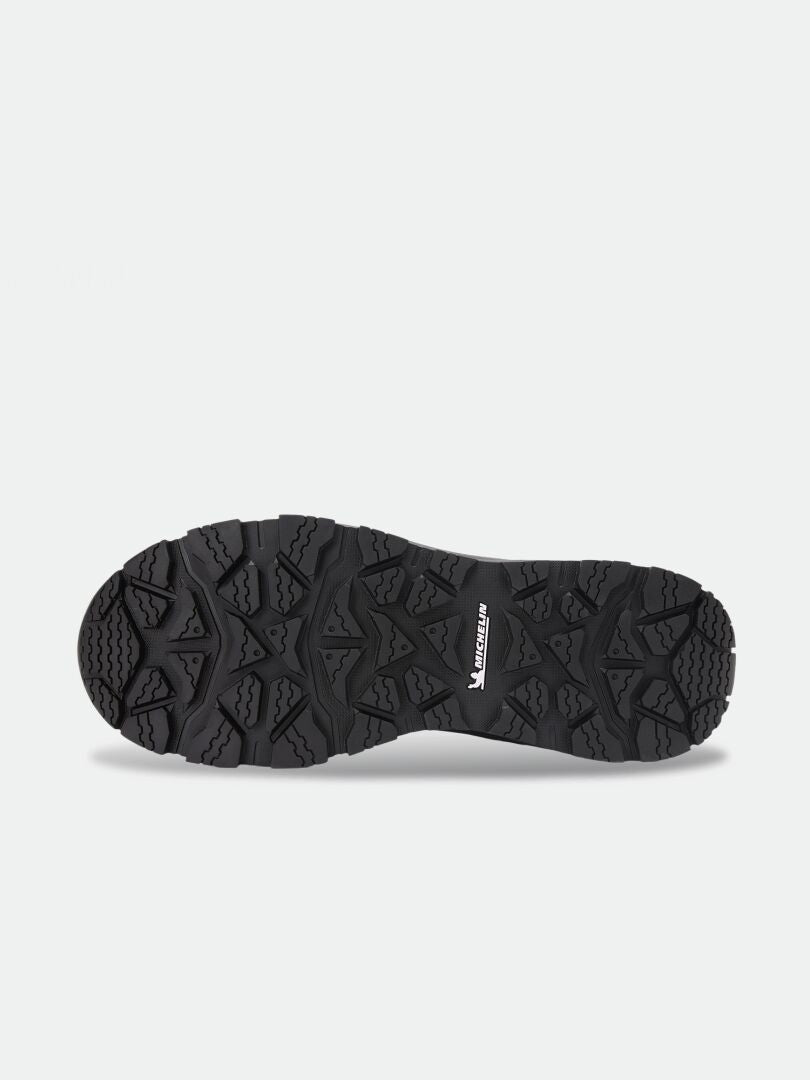 Black Tunturi Mid DX IC Winter Shoe with a lugged rubber outsole and patterned Michelin Ice Control tread.