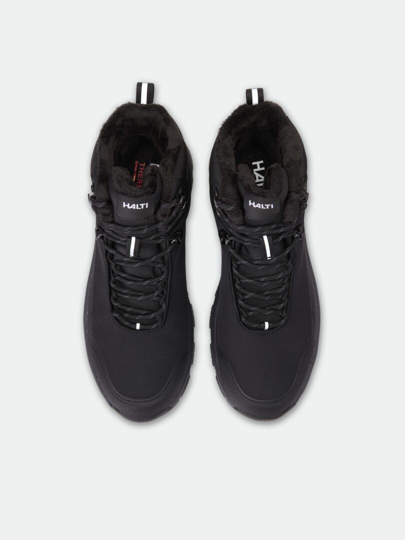 Black Tunturi Mid DX IC Winter Shoe mid-cut boots with a waterproof membrane, faux fur lining, and Michelin Ice Control sole.