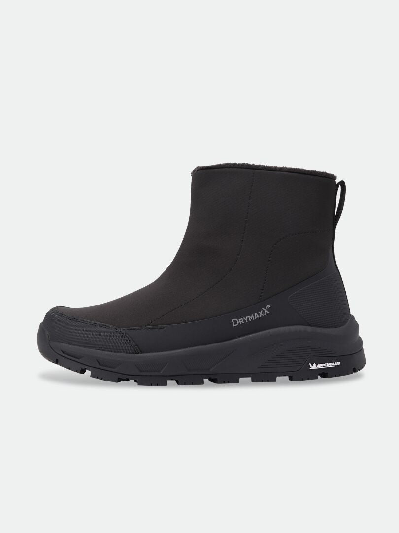 Black Kajuk Mid DX IC winter ankle boot with a thick Michelin Ice Grip outsole.