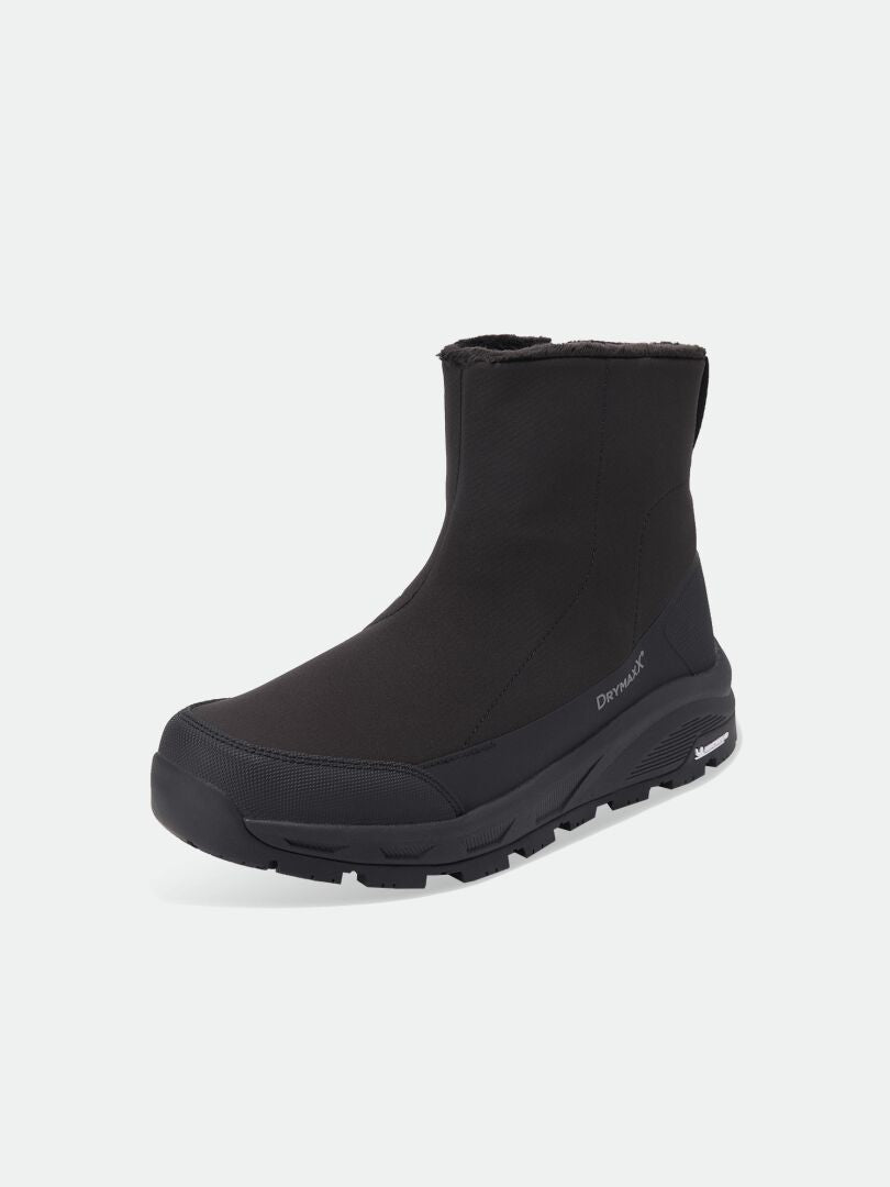 Black mid-calf Halti Kajuk Mid DX IC winter boot with a thick Michelin Ice Grip outsole and faux fur lining.