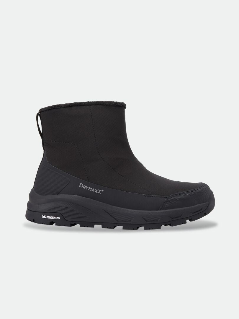 Black mid-calf Halti Kajuk Mid DX IC winter boot with a Michelin Ice Grip outsole and a DrymaxX logo on the side.