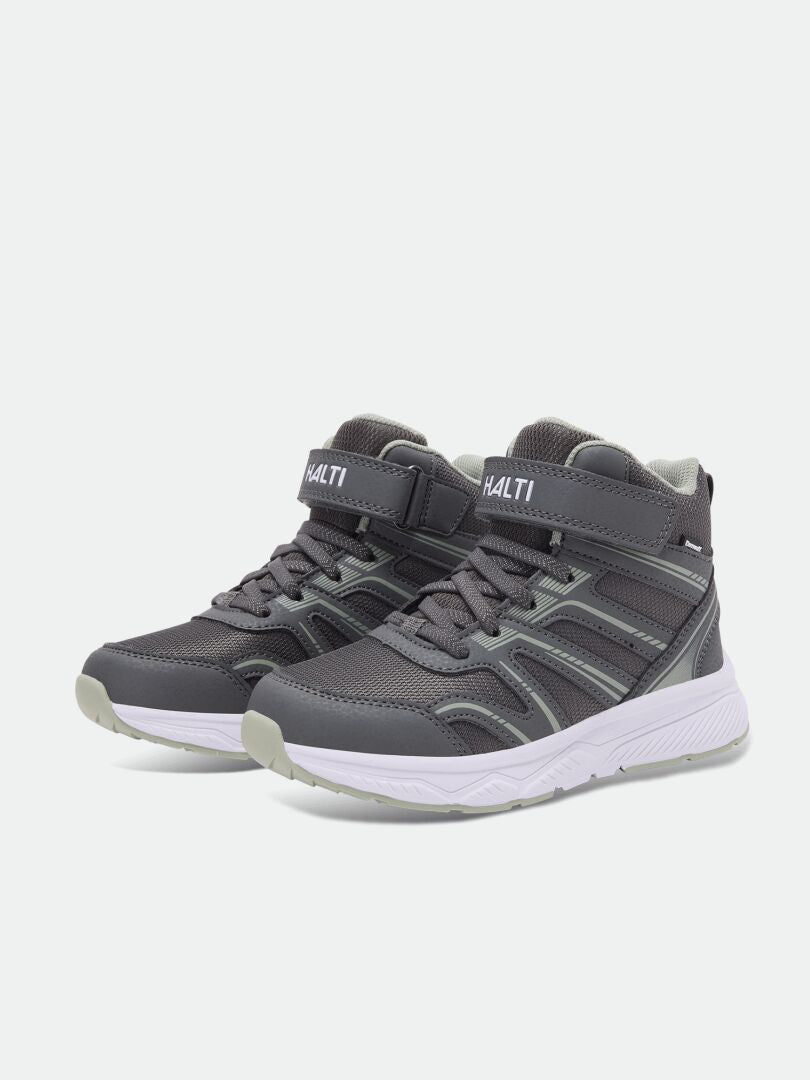 Halti Zuma Mid DX kids’ gray sneakers with white soles, Velcro straps, and waterproof branded tongues.