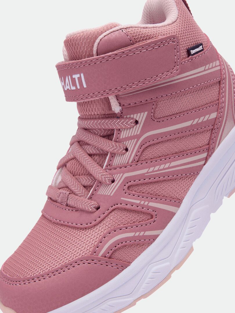 Close-up of a pink Halti Zuma Mid DX kids’ sneaker with laces, Velcro strap, and textured sole.
