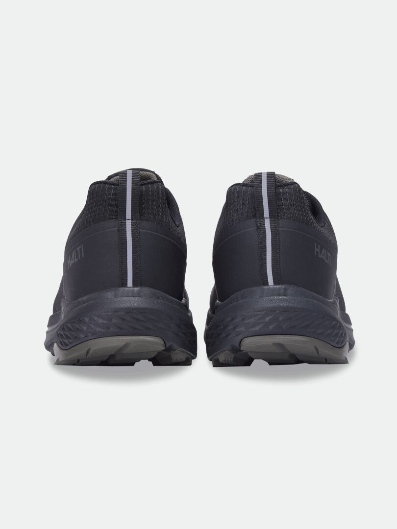 Rear view of Halti Asento DX men’s outdoor shoes, black with gray soles, vertical heel stripe, and natural fit.