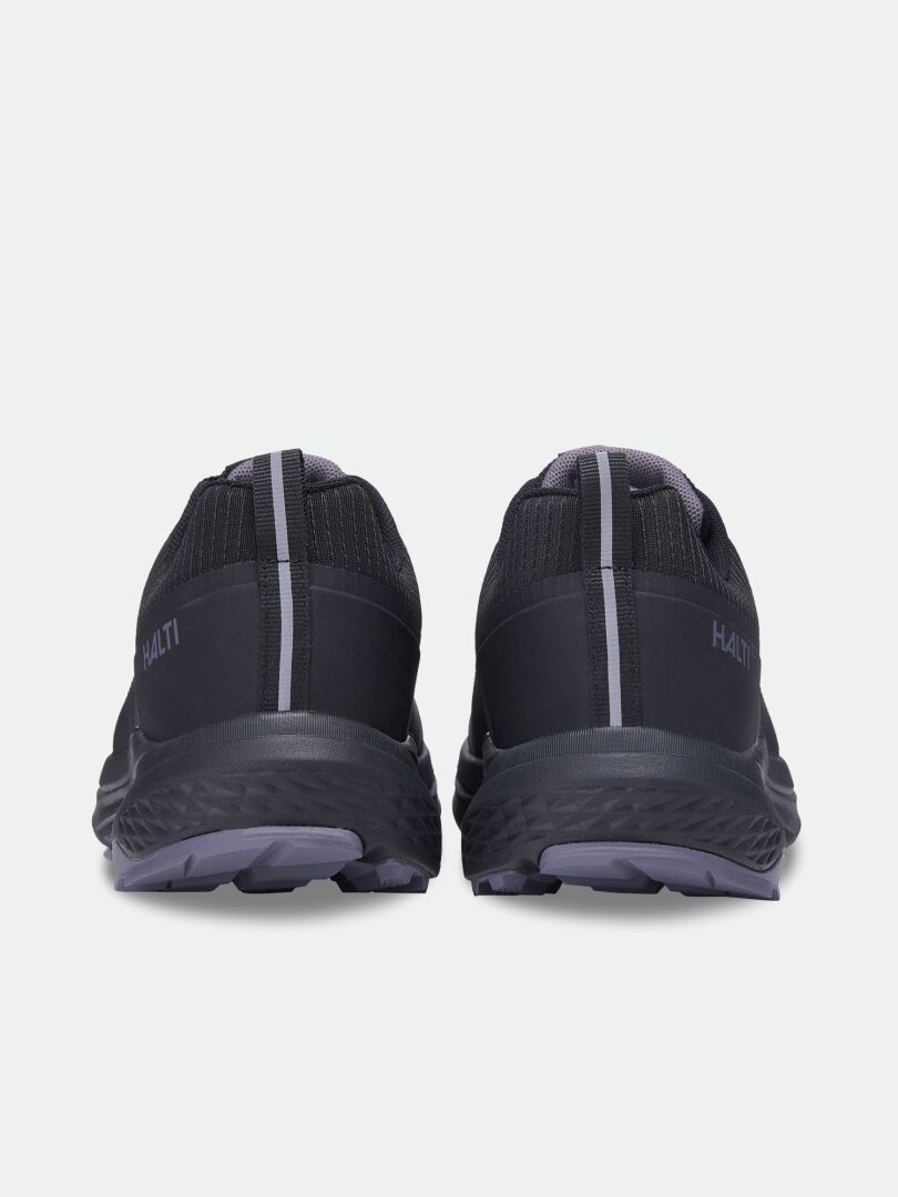 Rear view of Halti Asento DX Outdoor Shoe Women’s, black with gray soles, stripes, and zero-drop heel for natural fit.