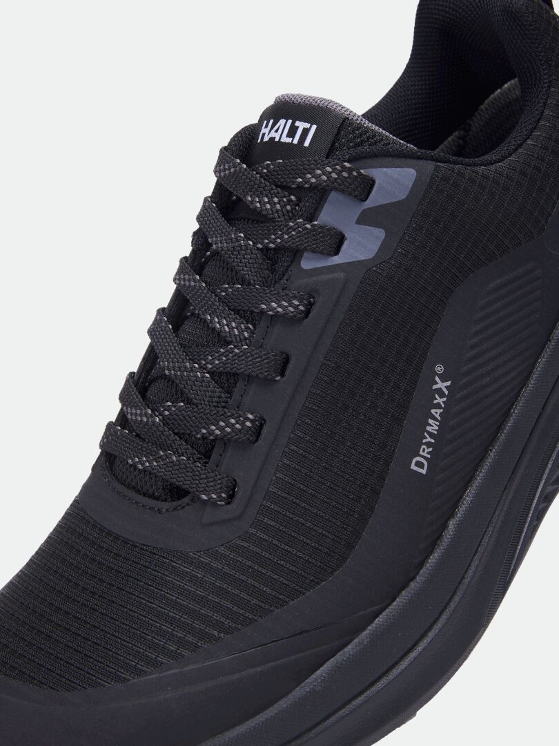 Close-up of Halti Asento DX Women’s black waterproof outdoor shoe with Drymaxx, black laces, and textured details.
