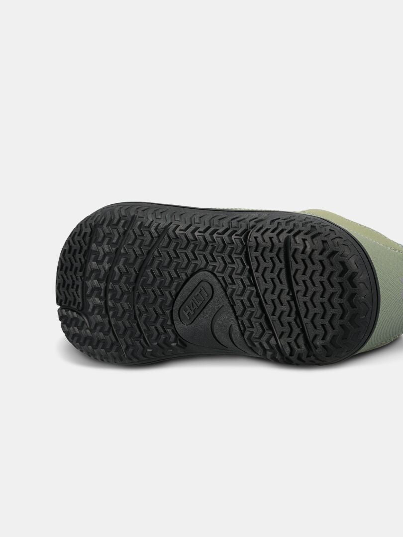 Close-up of the black sole on the Halti Tuntuma DX Barefoot Shoe Women's, shown against a white background.