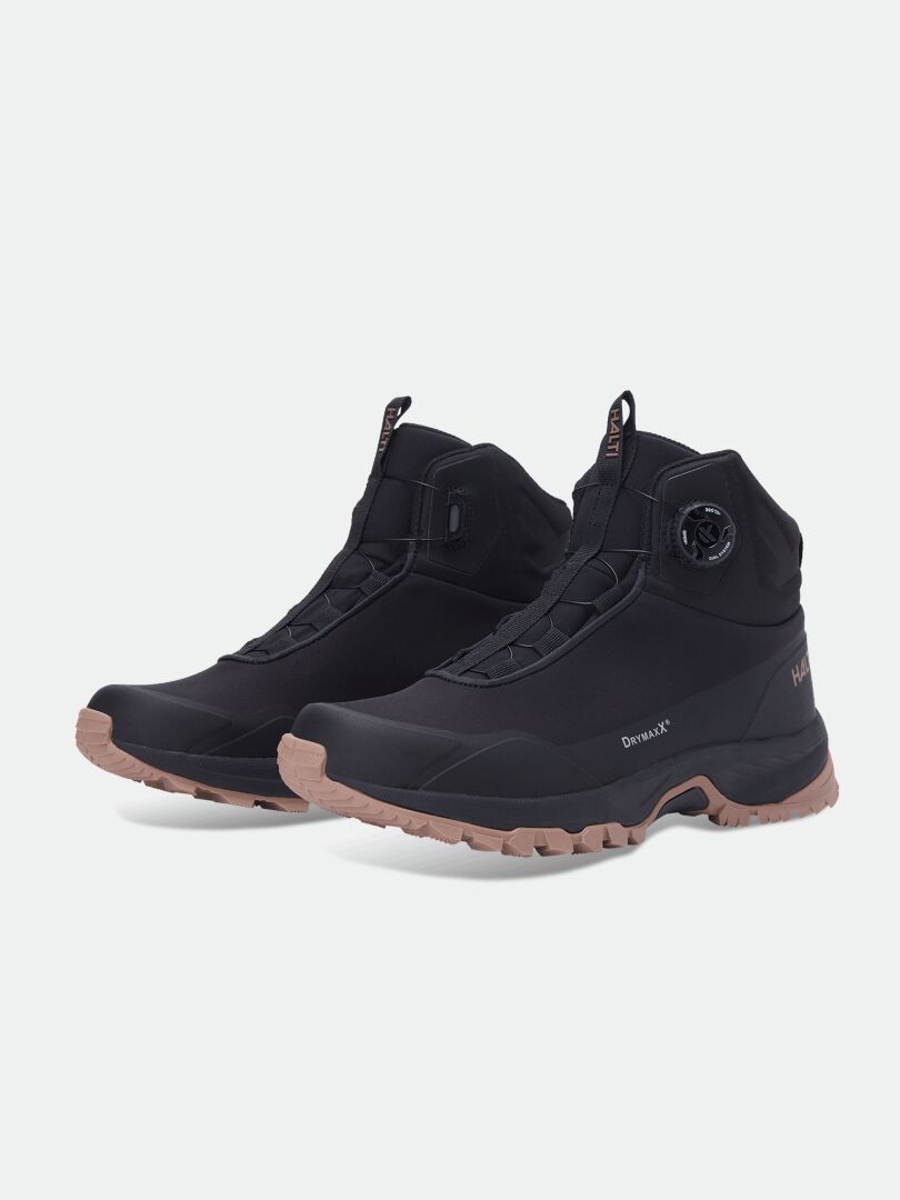 Halti Fara Mid 3 DX Freelock: black waterproof boots, thick tan soles, high ankles, side round adjustment dial.